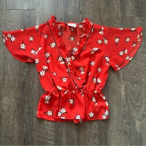 Red floral blouse